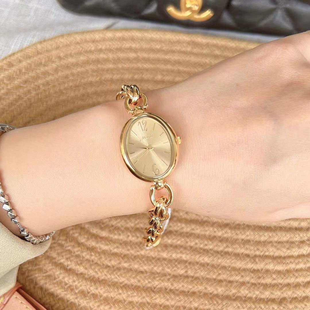 Lady's Steel Strap Watch Gold Oval Hollow Chain Quartz Watch